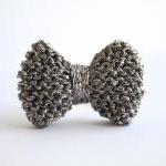 Bow ring knitted in gun met..