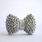 Bow ring knitted in silver:..